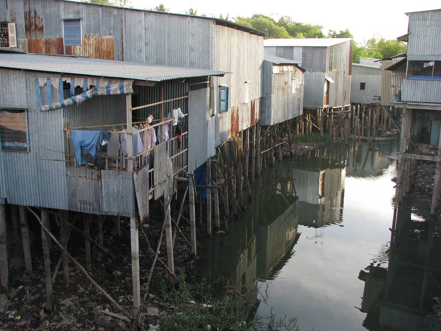 Stilt houses along a narrow Mekong Delta canal