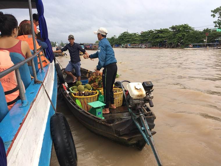 Boats trading fruit at Cai Rang floating market near Can Tho
