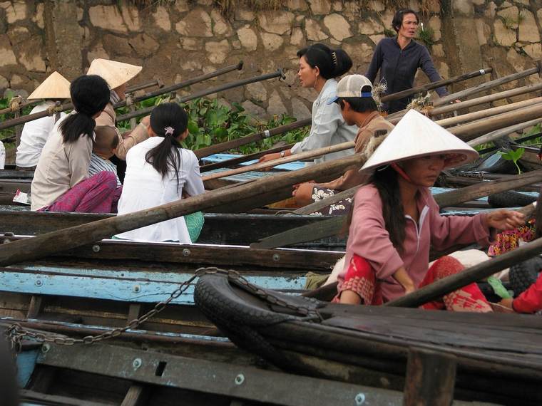 Passengers waiting for an early morning boat on the Mekong